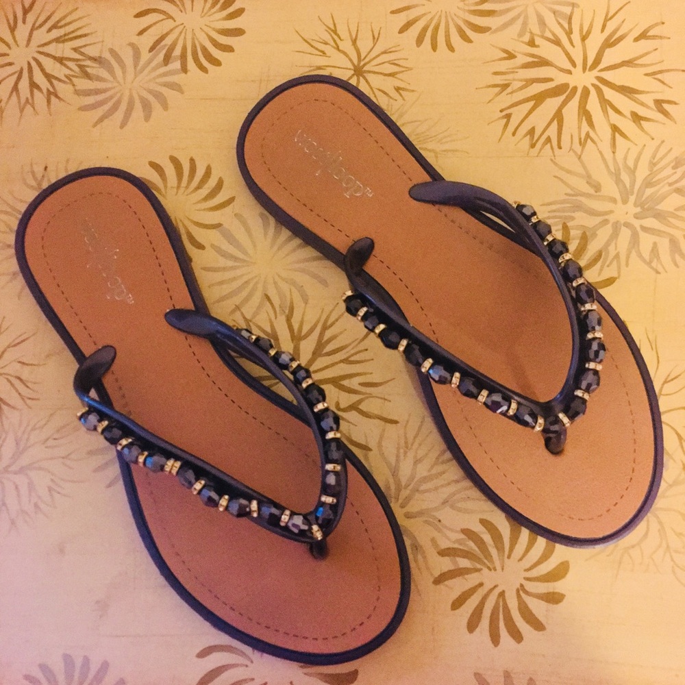 Blue jeweled flip flops